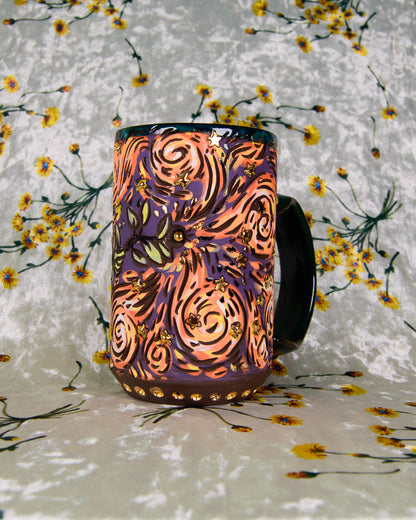 Decorative mug with colorful patterns on a floral background