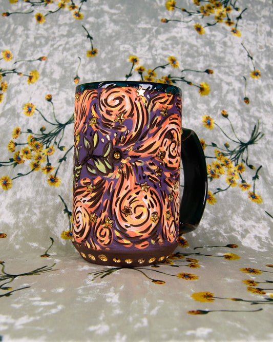 Decorative mug with colorful patterns on a floral background