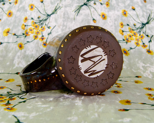 Bottom of a ceramic mug with LAW Leigh Weinberg signature, maker's mark from Lawful Studios