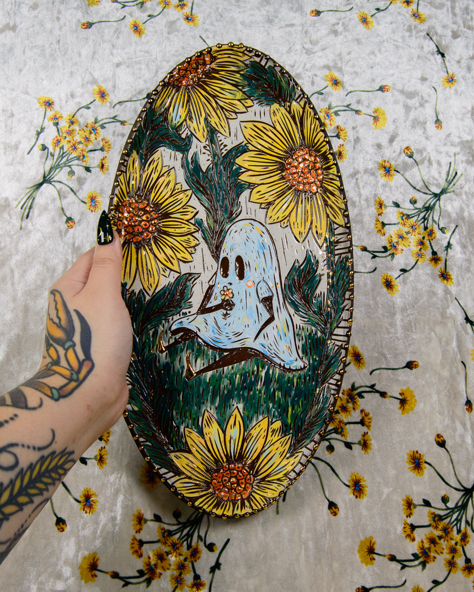 Handmade ceramic stoneware plate with a ghost holding flowers design