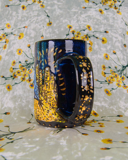 Decorative mug with artistic star design on a floral background