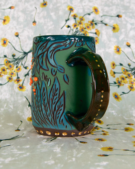 Decorative mug with floral design on a floral background