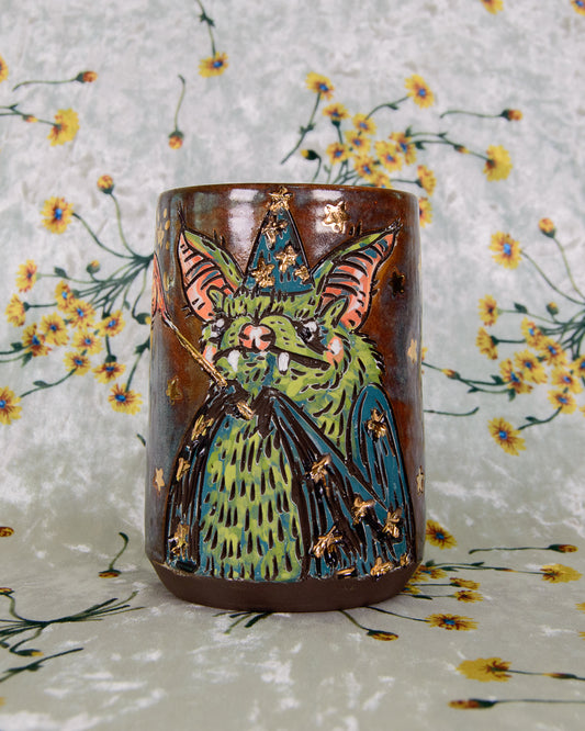 Stoneware Cup with a green bat wizard design and gold shiny stars