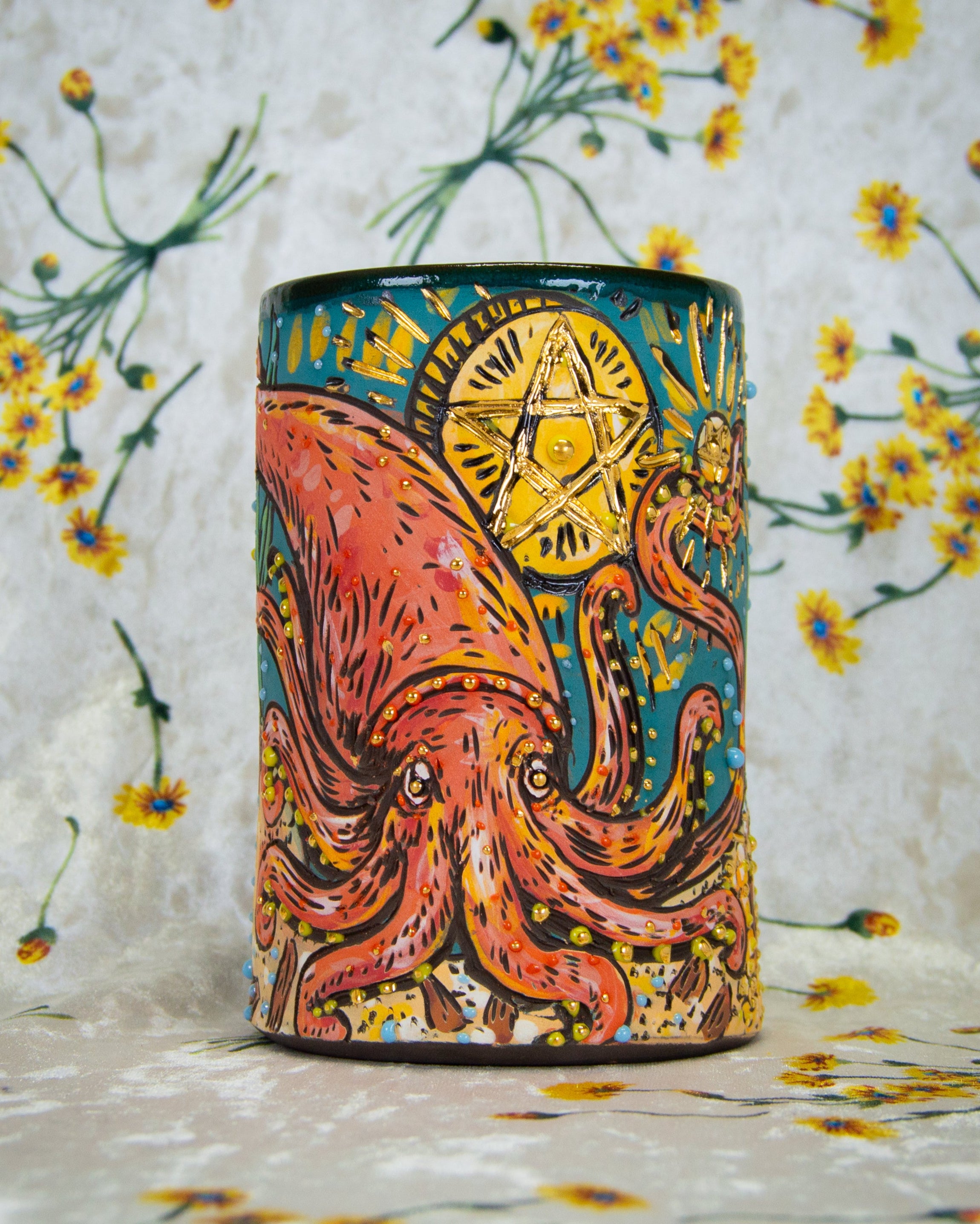Handmade ceramic mug with a colorful giant squid and pentacles design