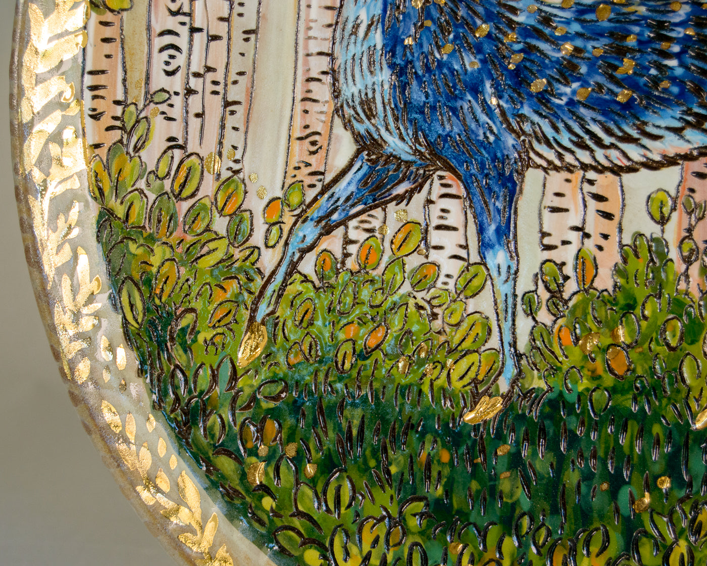 Decorative plate with a deer and nature scene