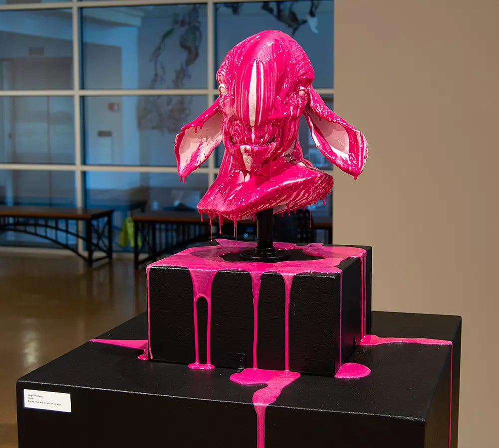pink and black Ceramic Sculpture of a goat monster with dripping epoxy resin