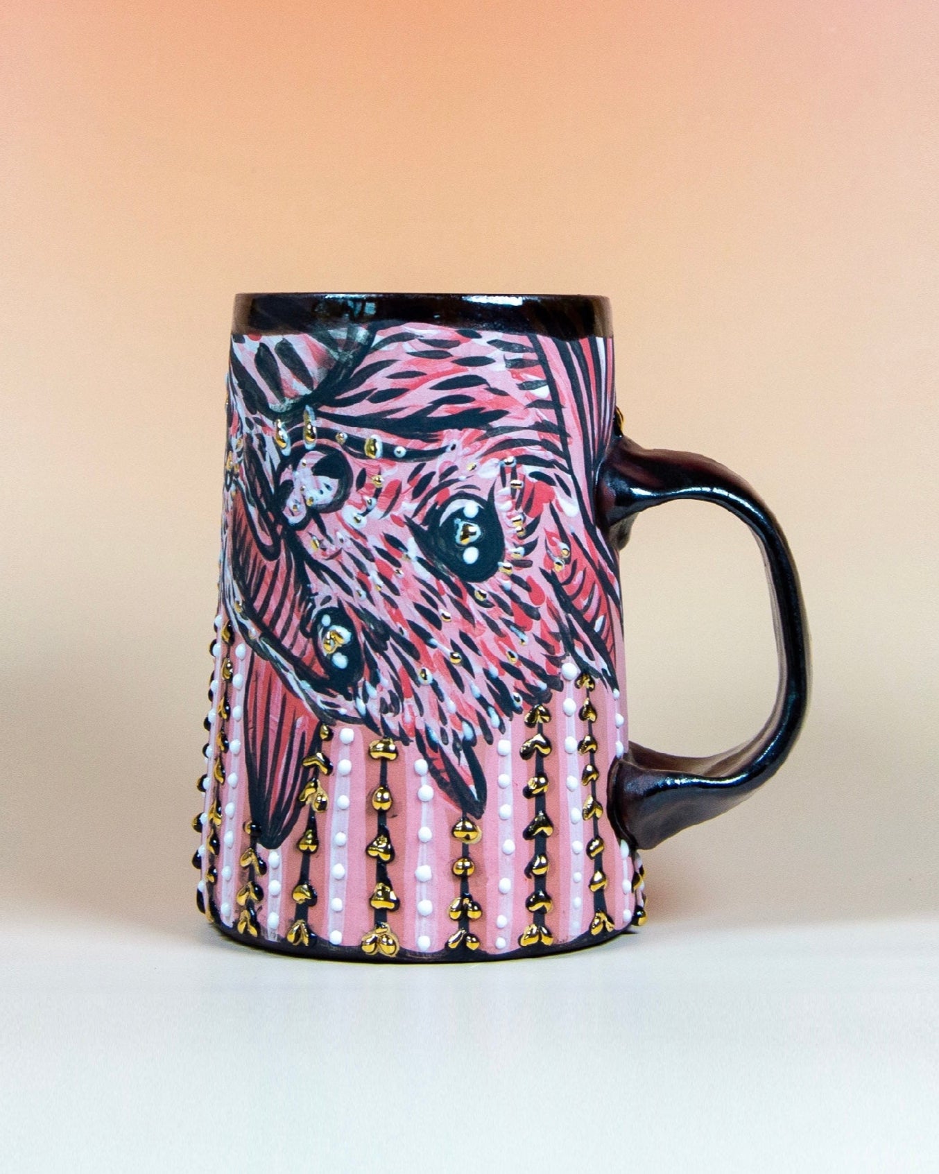 Handmade ceramic mug with stylized bats and hearts designs to gift for valentine's day