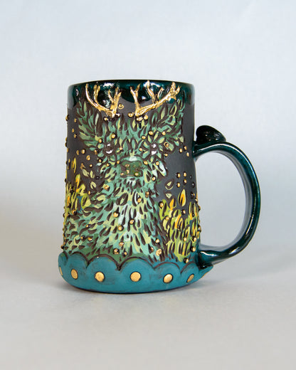 Decorative mug with nature-themed deer design on a white background