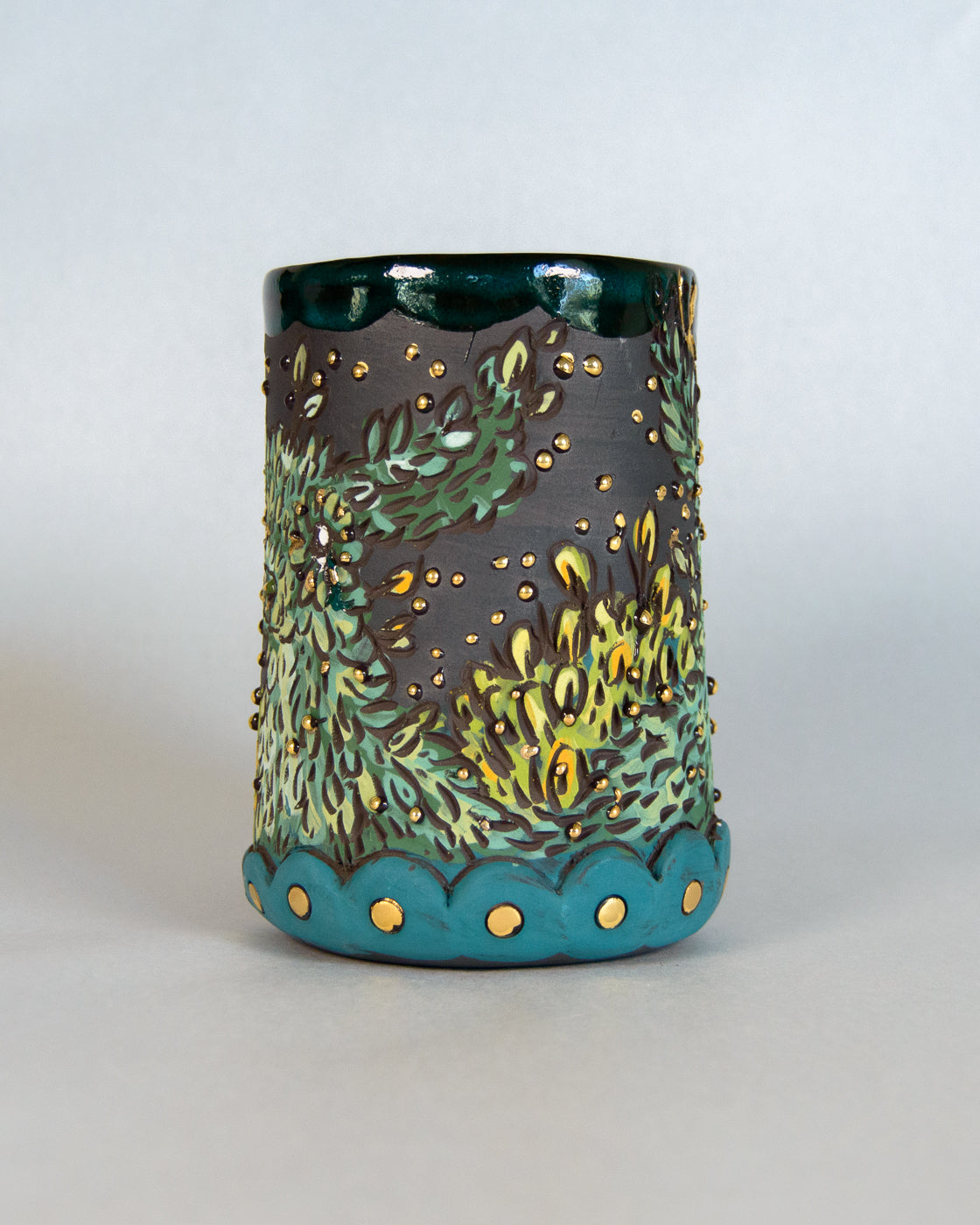 ceramic mug green and gold deer design on a white background