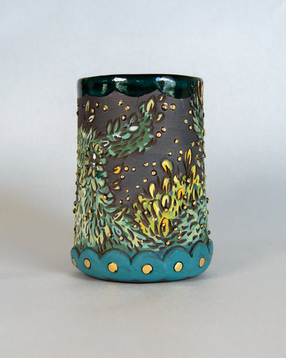 ceramic mug green and gold deer design on a white background