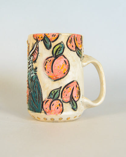 Ceramic mug with peach design on a light gray background
