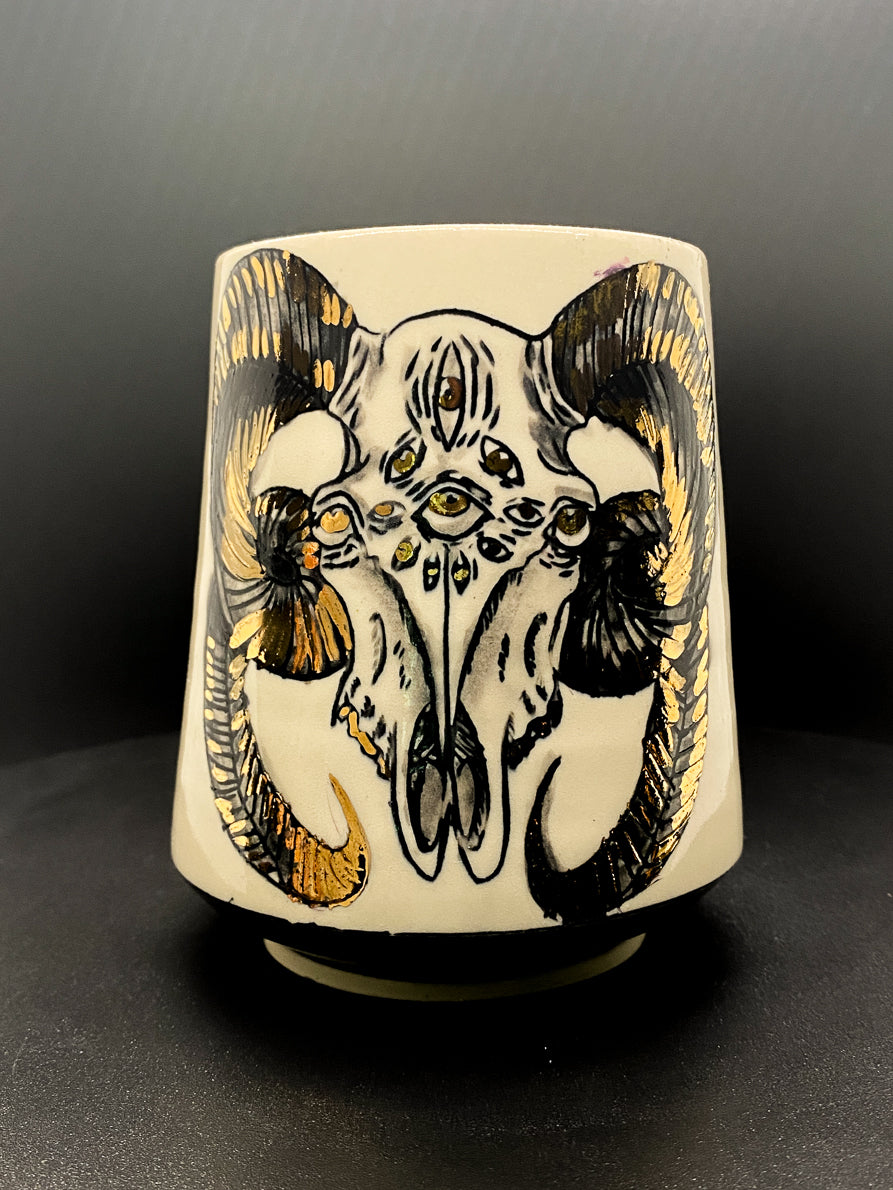 Handmade ceramic porcelain mug with a spooky ram skull design for the ares zodiac