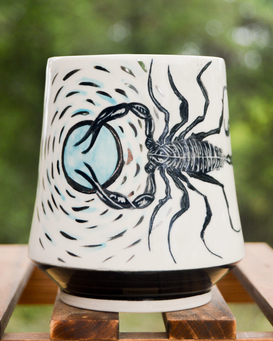 Handmade ceramic porcelain mug with a black scorpion design for the scorpio zodiac astrology sign