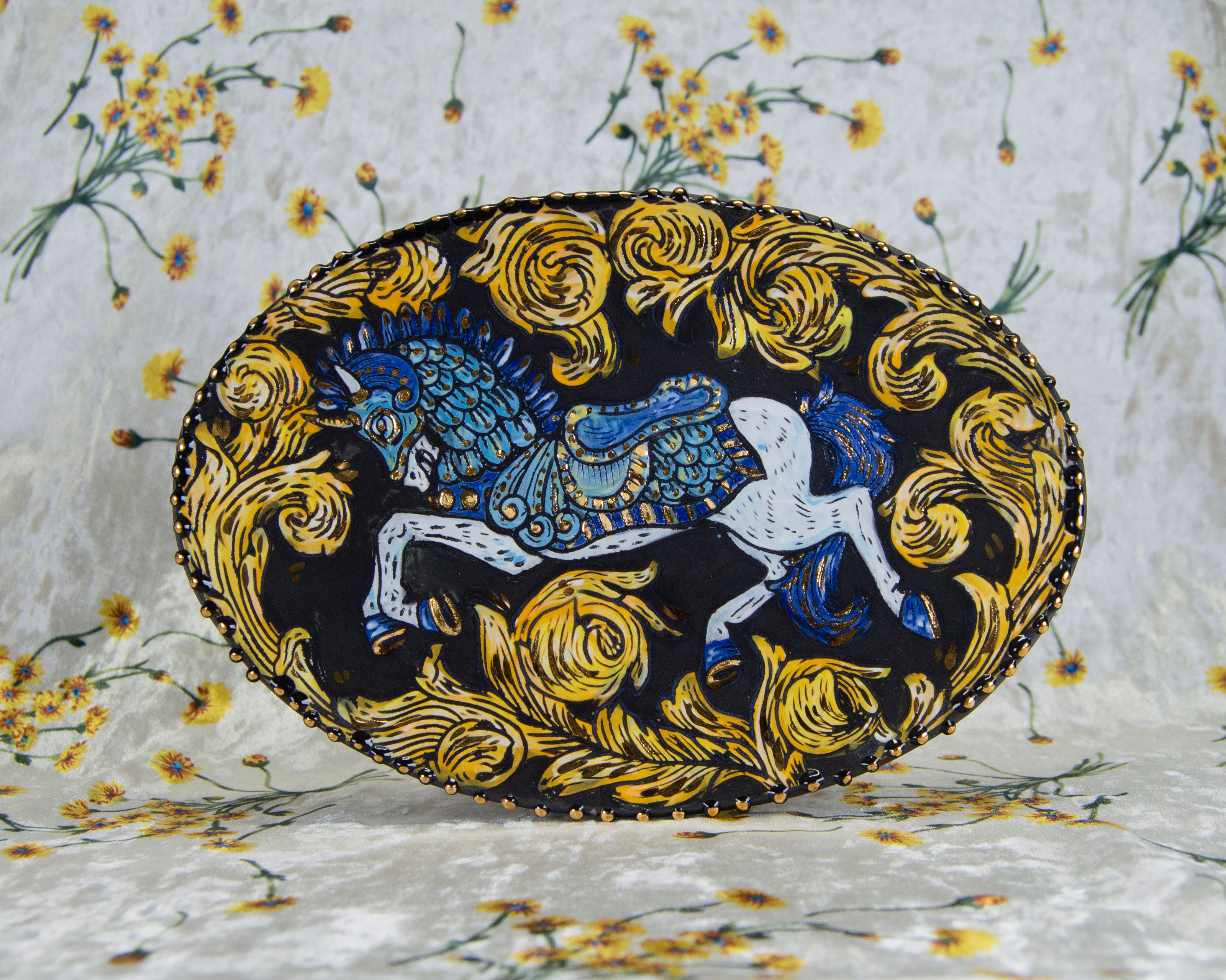 Handmade ceramic porcelain plate with a stylized carousel horse illuminated manuscript design
