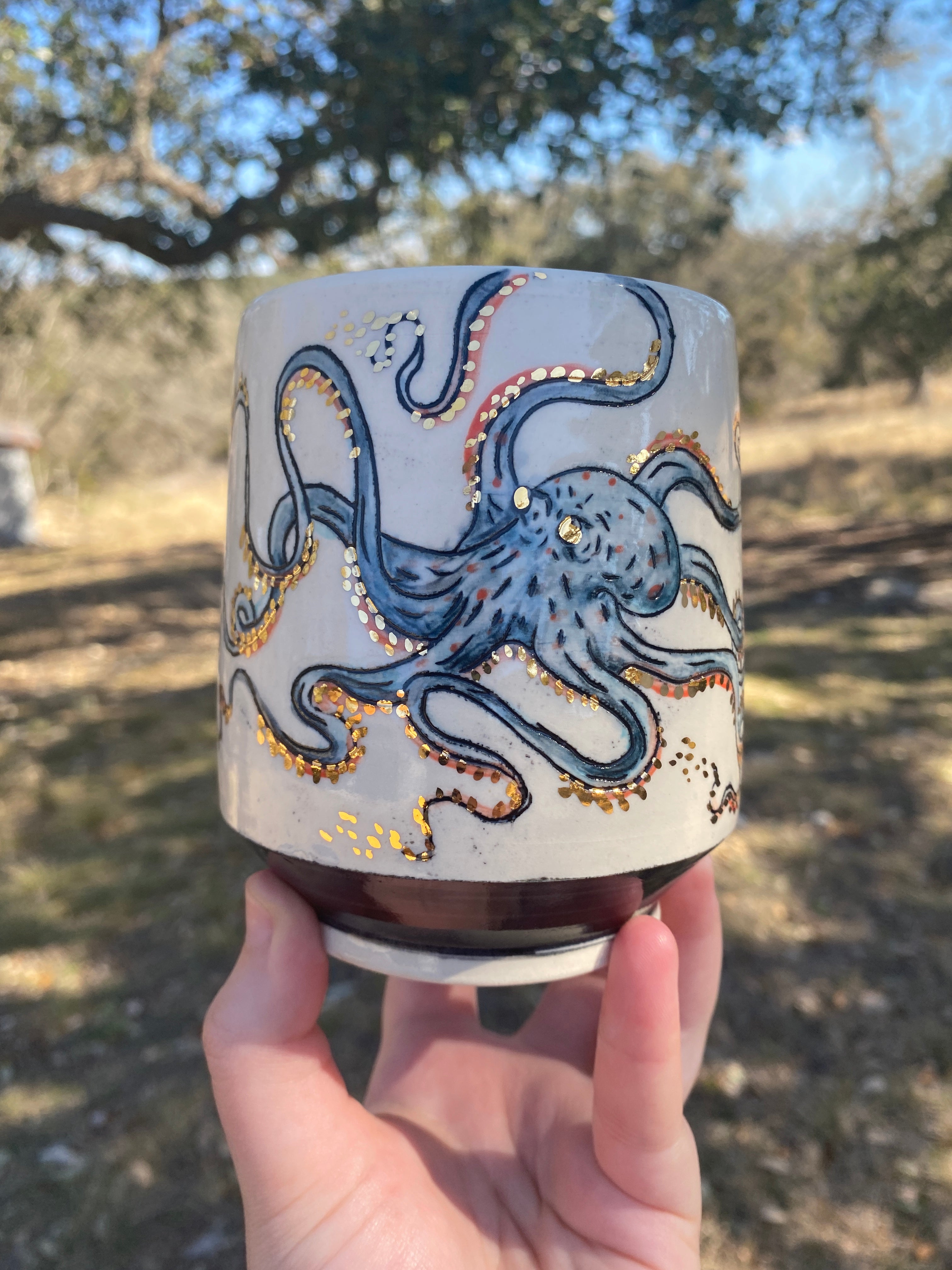 Handmade ceramic porcelain mug with a blue octopus design