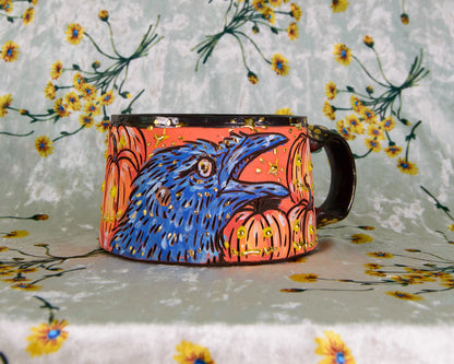 Colorful mug with a bird design on a floral background