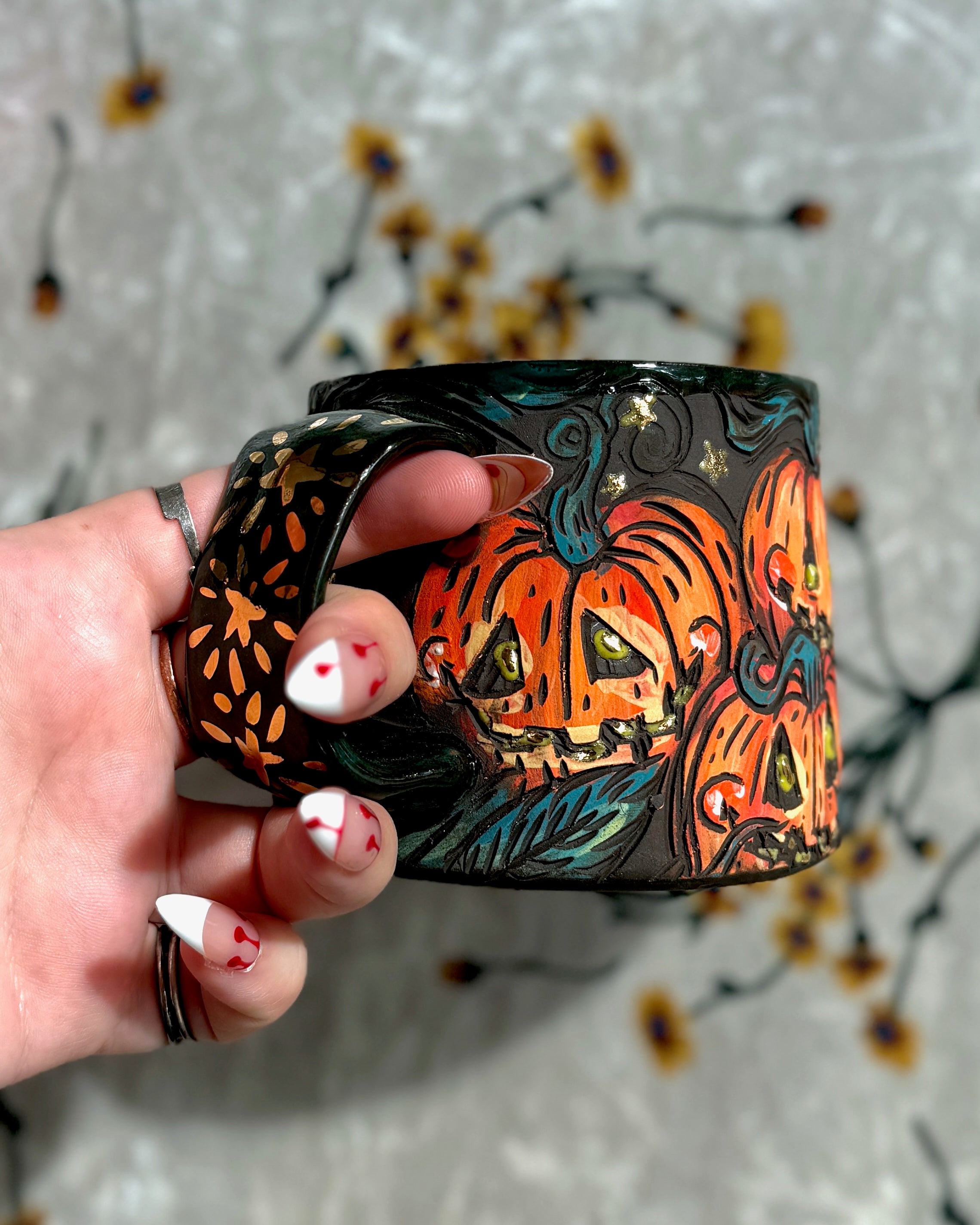 Handmade ceramic stoneware mug with cute smiling pumpkin designs