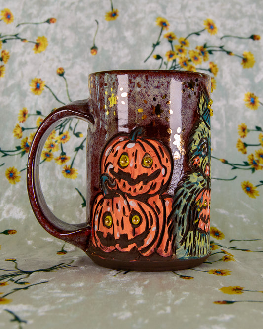 Halloween themed ceramic mug with cartoon pumpkins