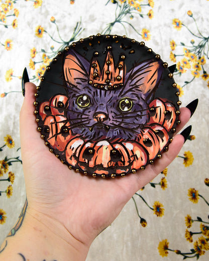 Ceramic coaster with a halloween cat and pumpkins design