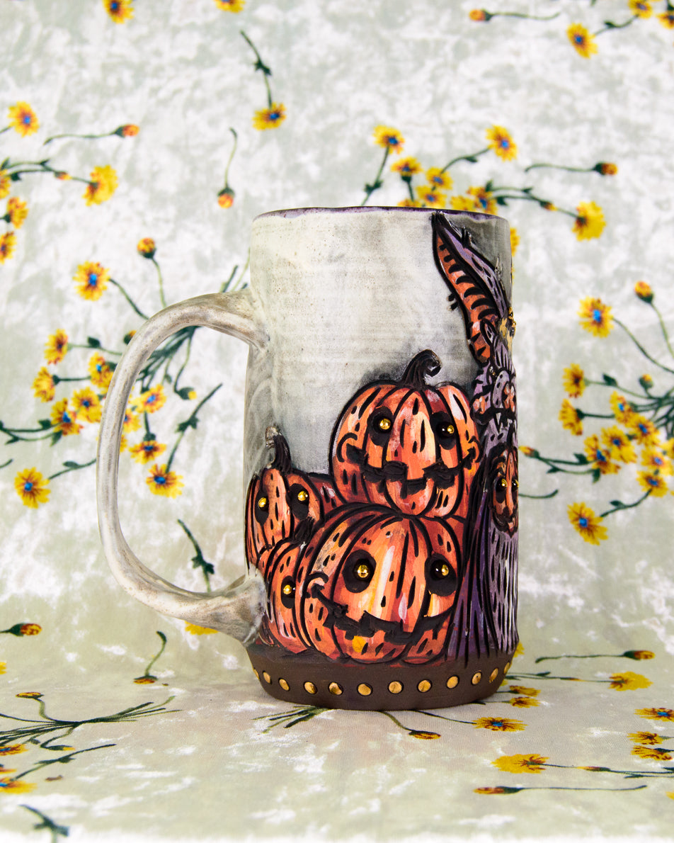 Decorative mug with pumpkins design on a floral background