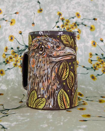Mug with a crow design on a floral background