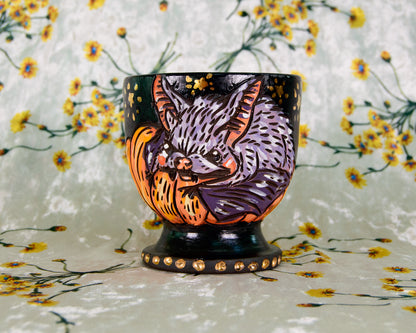 Ceramic goblet cup with a cute cartoon bat and pumpkin design
