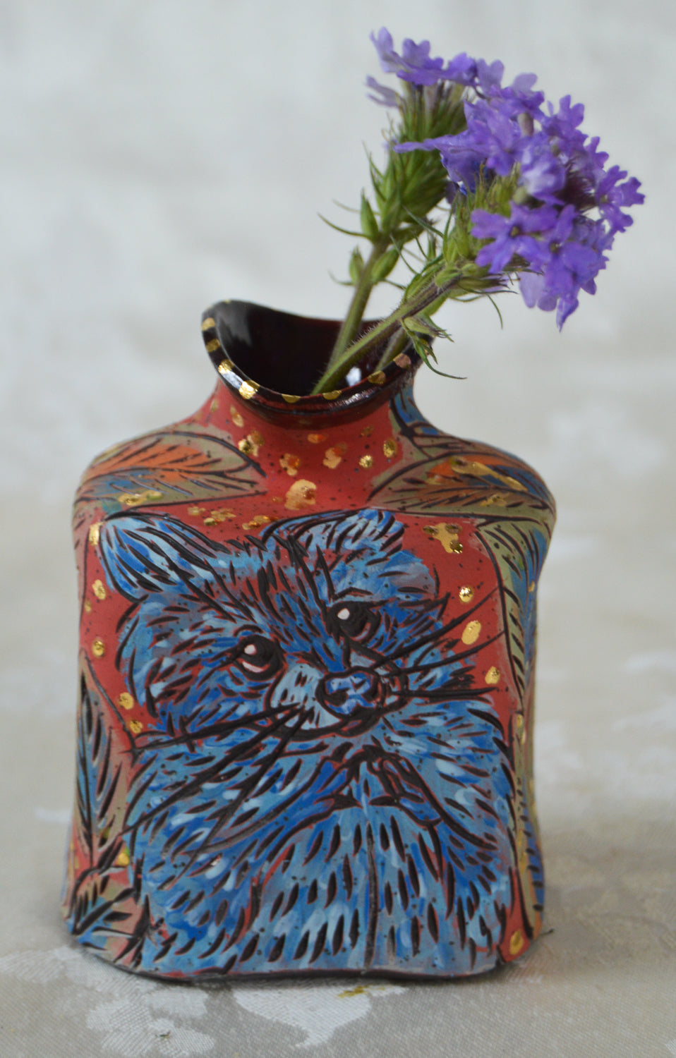 Handmade ceramic stoneware vase with raccoon designs