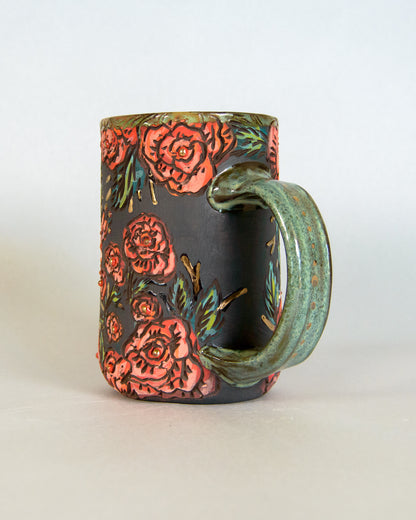 Ceramic mug with floral design on a white background