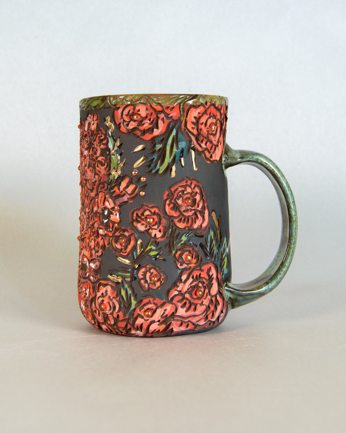 Ceramic mug with floral design on a white background