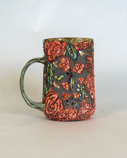 Ceramic mug with floral design on a plain background