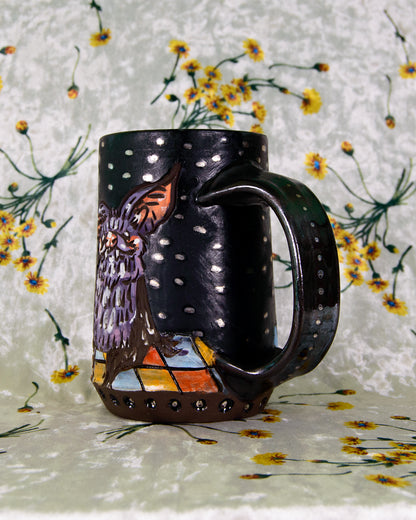 Decorative mug with bat design on a floral background