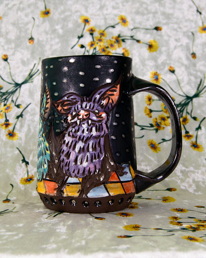 Black matte mug with a purple dancing bat design