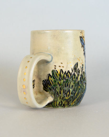 Ceramic mug with a nature-themed design on a light gray background