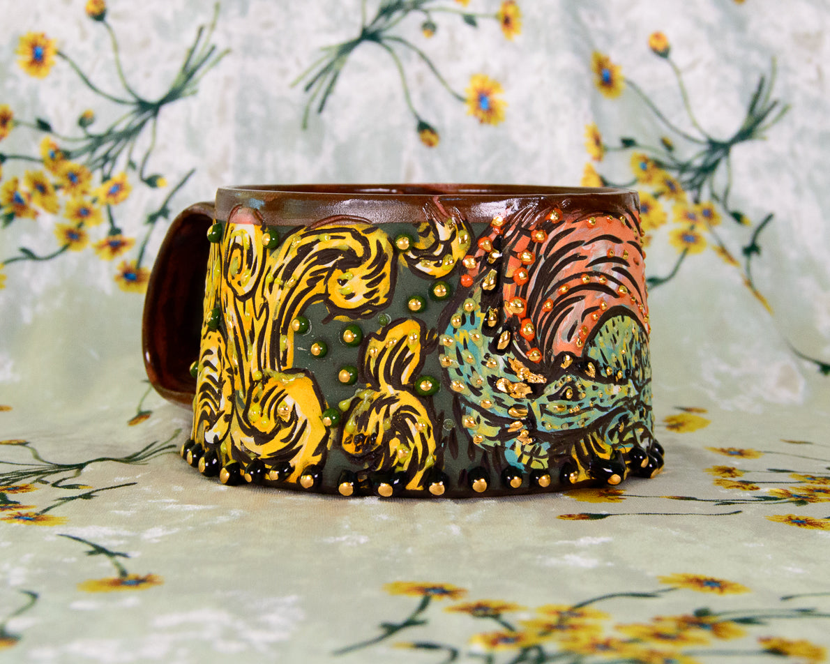 Handmade ceramic mug with colorful patterns on a floral background