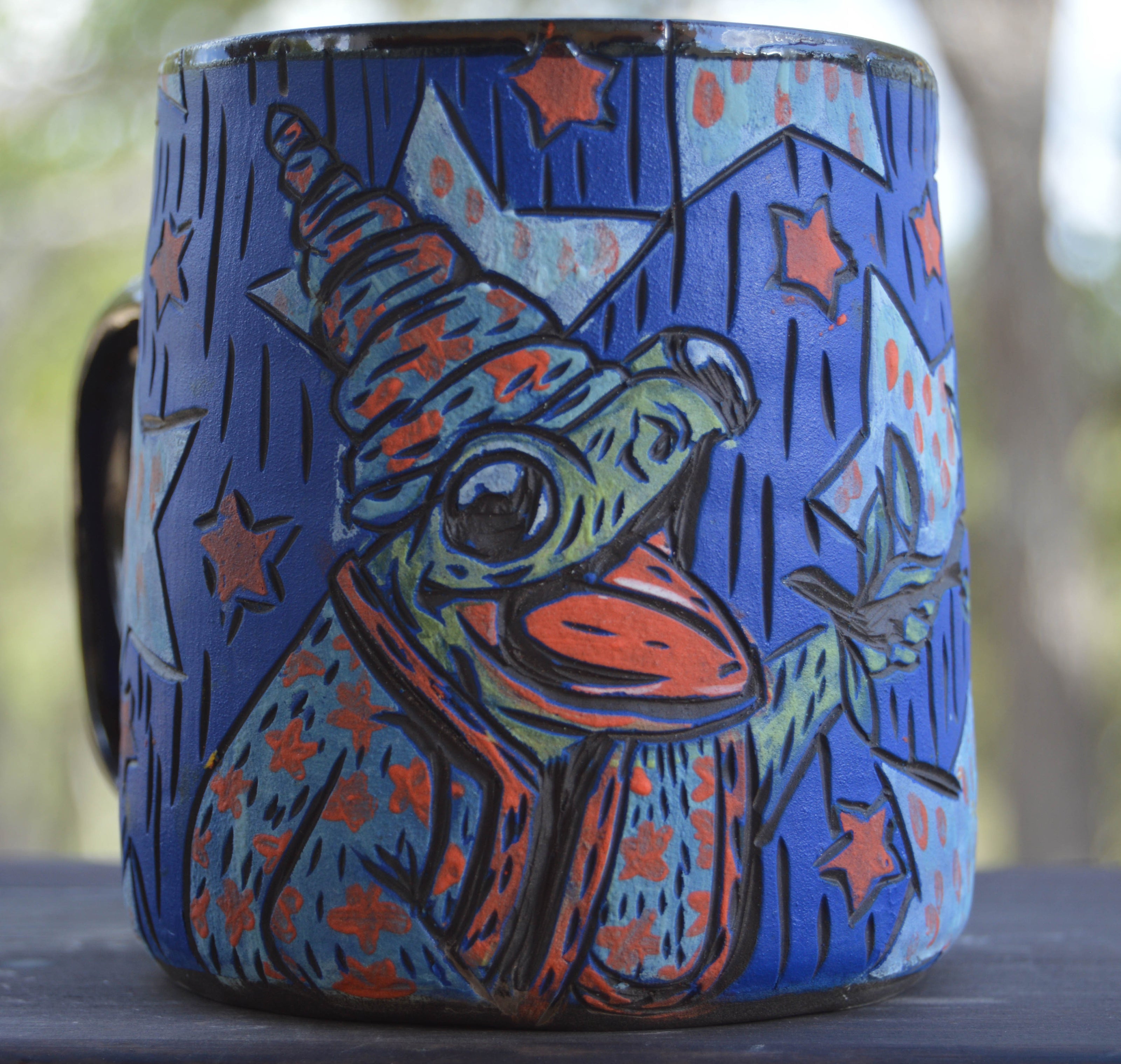 Handmade ceramic stoneware mug with a cute magic frog wizard and stars design