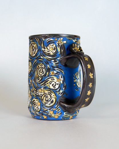 Ceramic mug with artistic star  design on a white background