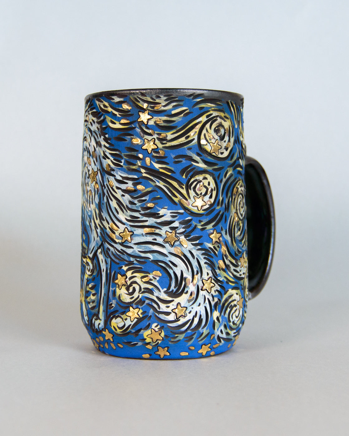 Mug with starry night design on a white background