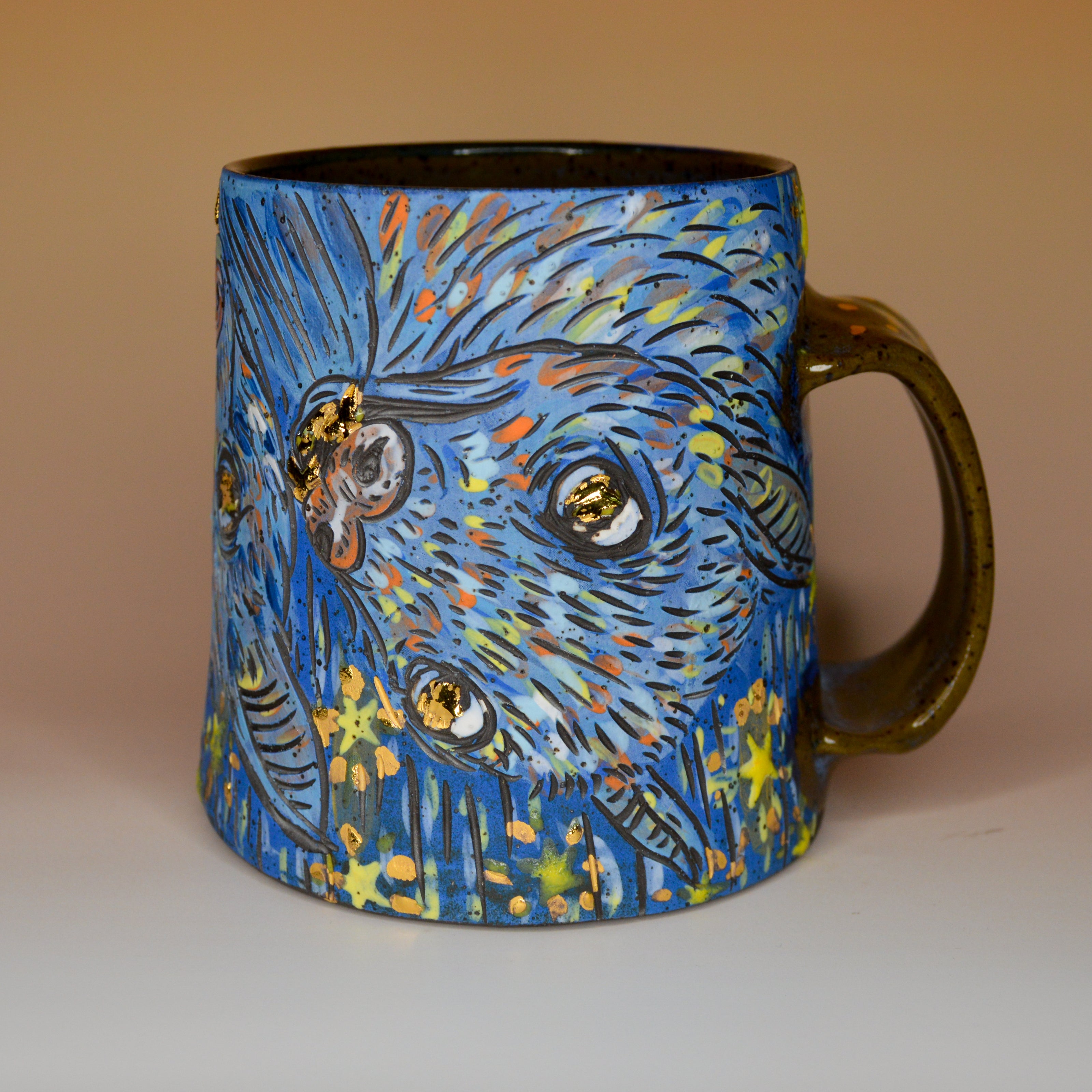 Handmade ceramic stoneware mug with blue bats on a star background