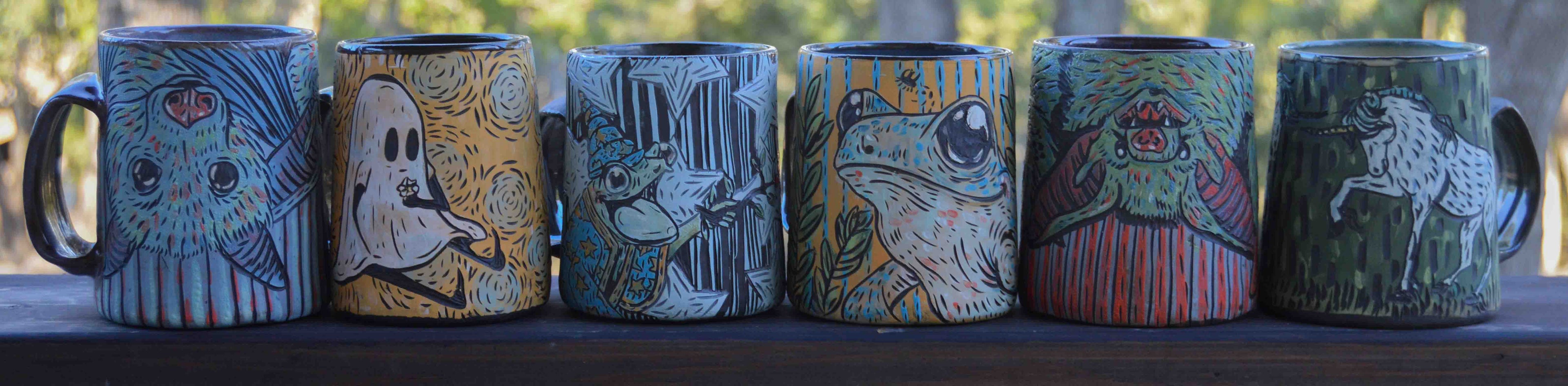 Various handmade ceramic stoneware mugs with stylized colorful animal designs