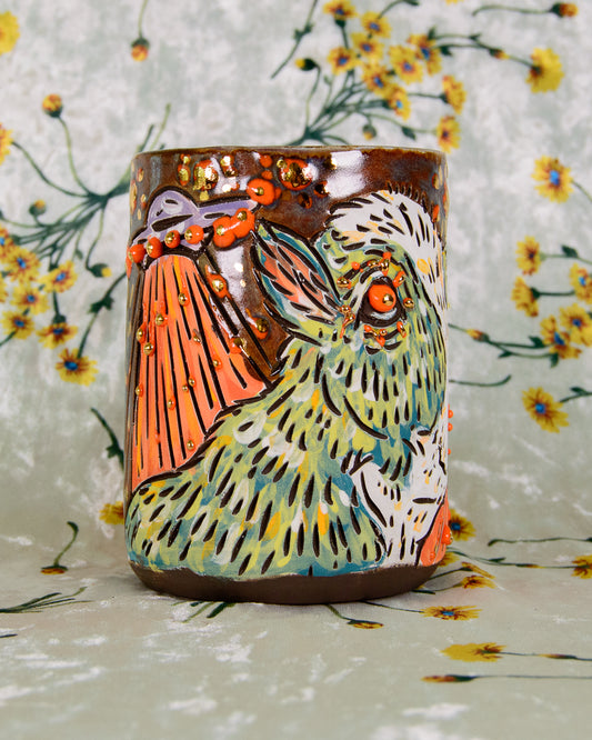 Ceramic cup with a colorful cow and UFO design