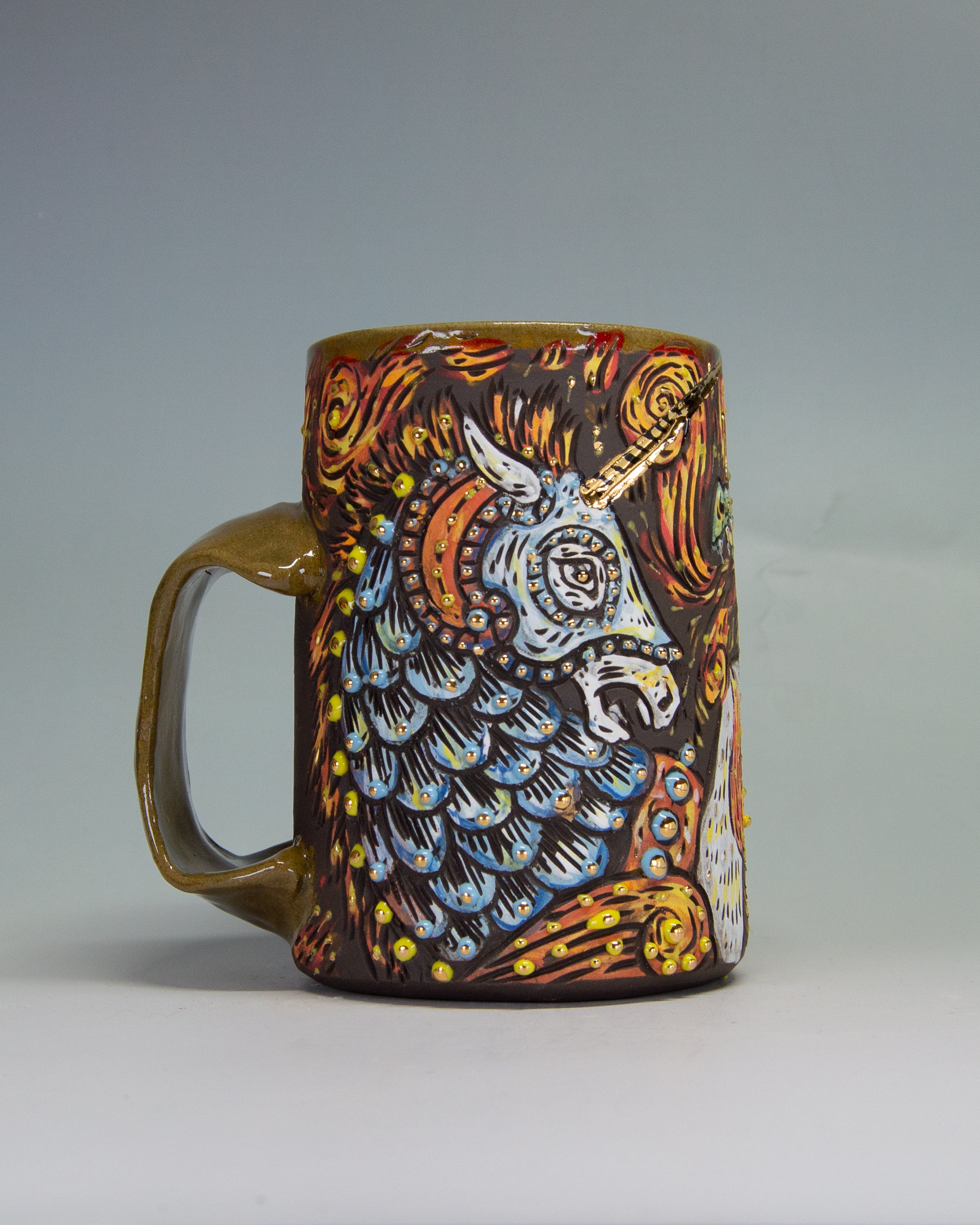 Handmade ceramic mug with an ornate unicorn knight design