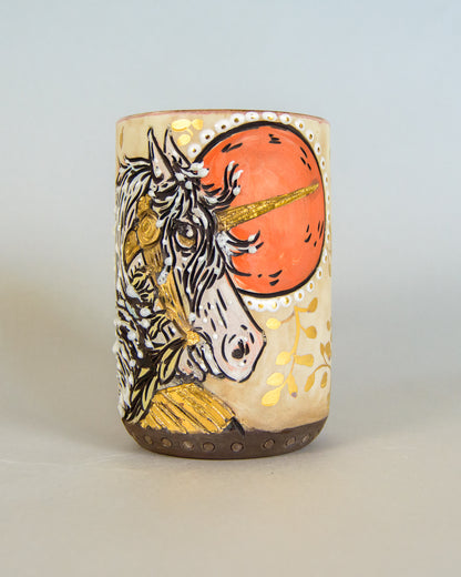 ceramic mug with unicorn design on a light gray background