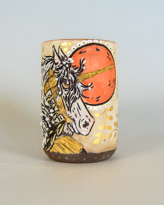 ceramic mug with unicorn design on a light gray background