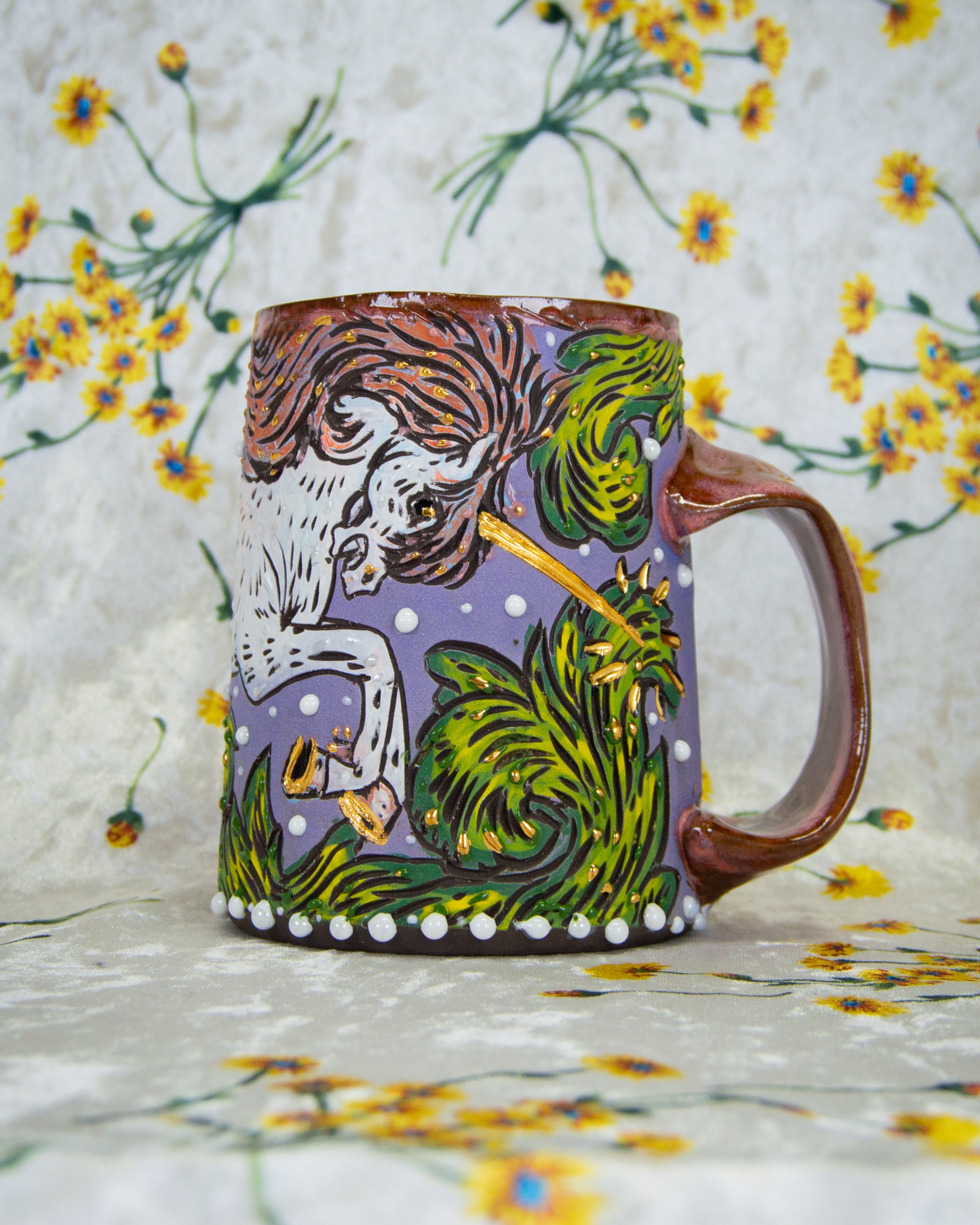 Colorful mug with stylized medieval unicorn design on a floral background