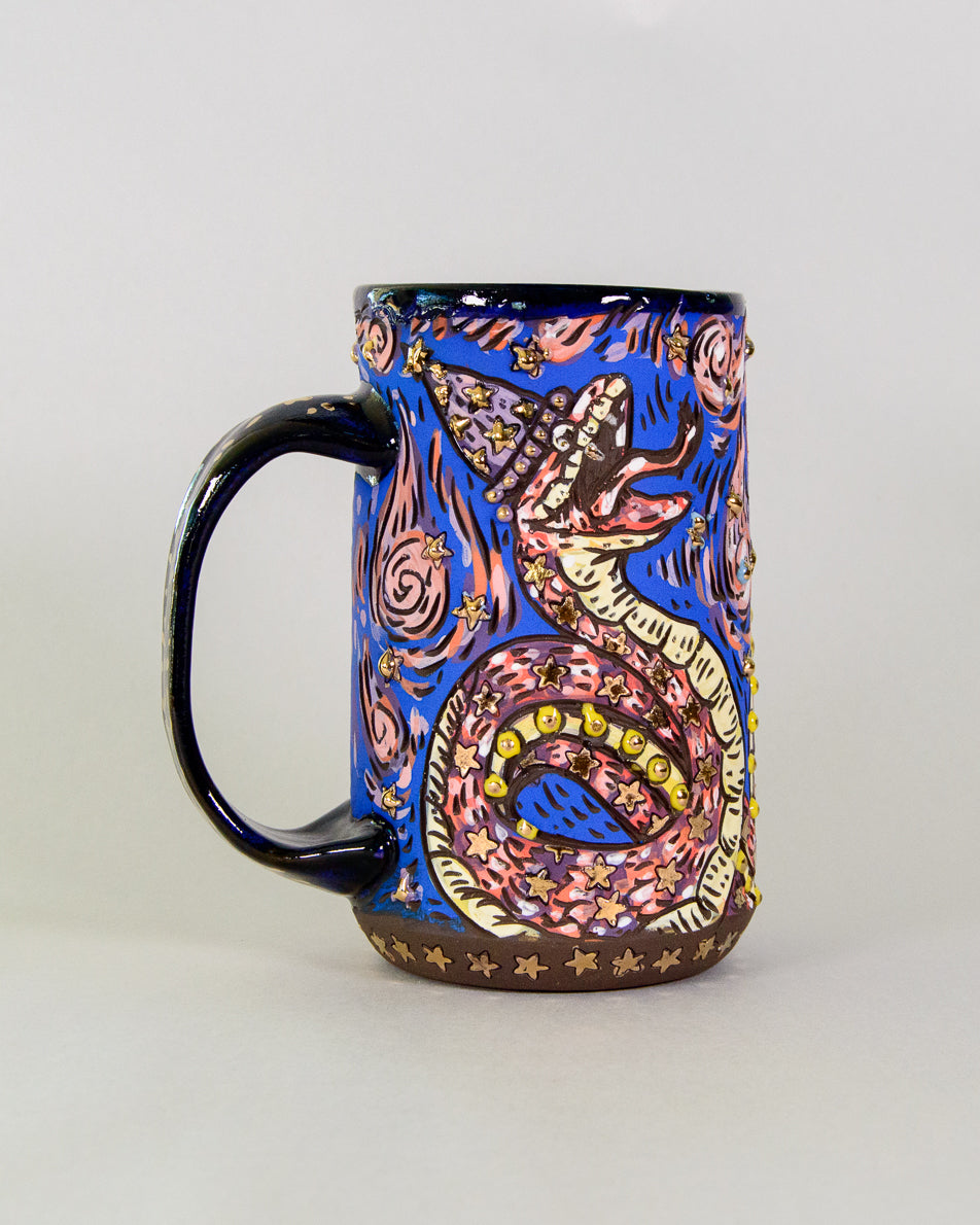 Handmade ceramic mug with a colorful cute snake wizard design
