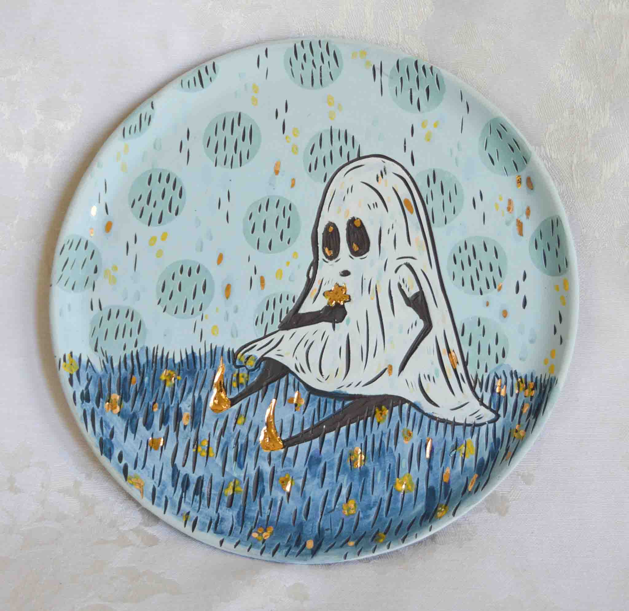Handmade ceramic stoneware plate with a ghost and flower design